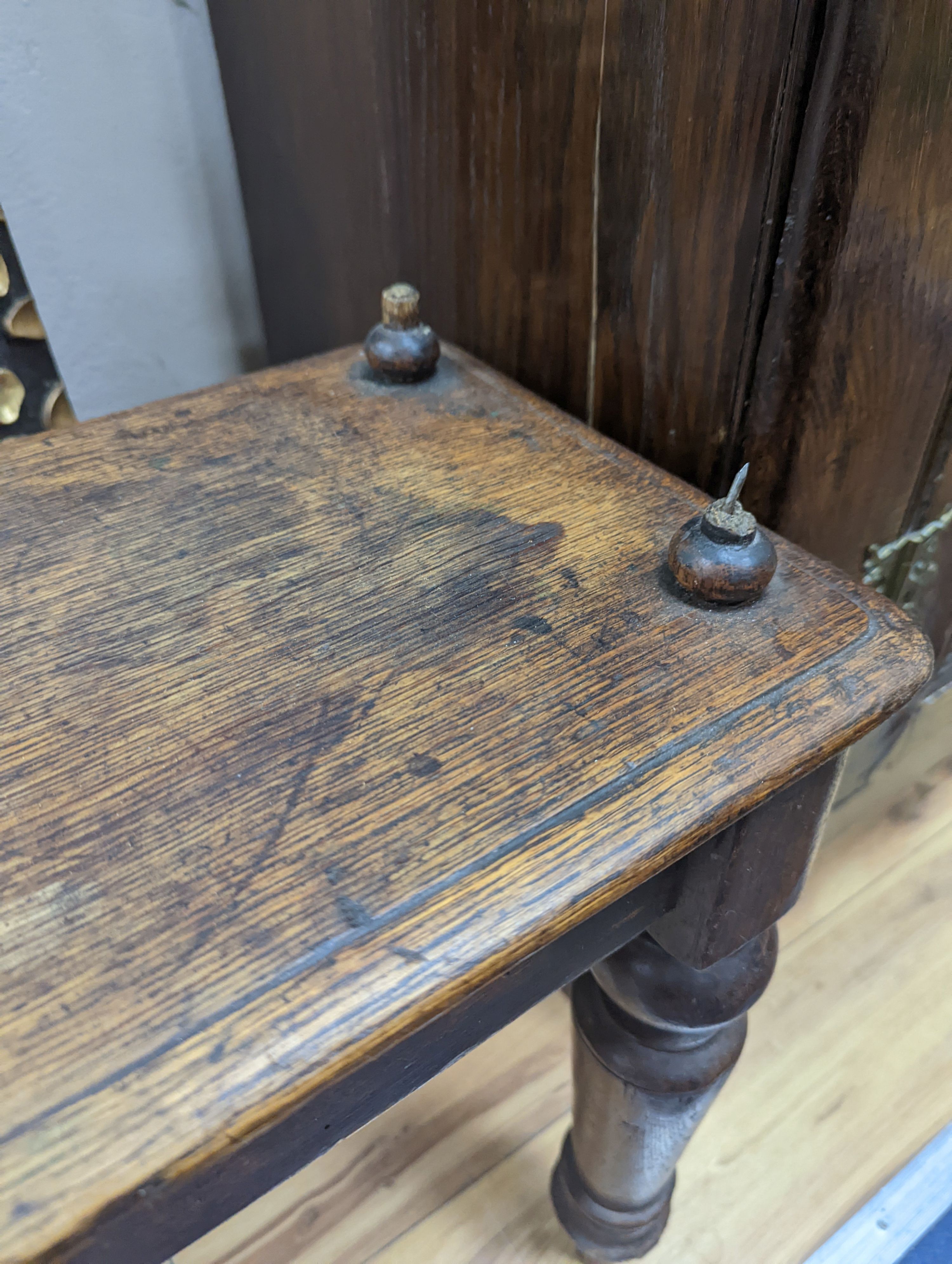 A Victorian oak window seat W-107cm, D-28cm, H-53cm, one handle bar detached but present